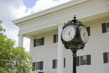 Fototapeta na wymiar Old clock in the square city of Coccoa