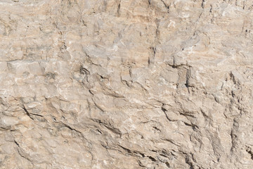 Background geology closeup limestone rock face showing weathered strata wallpaper