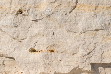 Background geology closeup limestone rock face showing weathered strata wallpaper