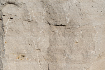 Background geology closeup limestone rock face showing weathered strata wallpaper