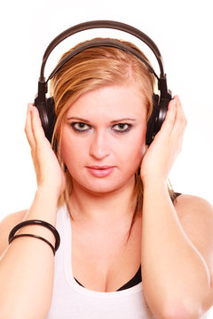 Portrait woman listening to music on headphones