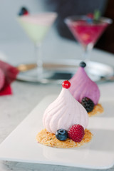 White soufle cake on white ceramic plate at restaurant.