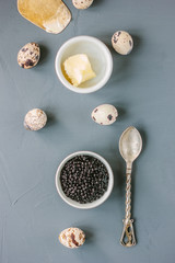 Top view of black caviar in white ceramic bowl.