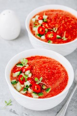 Watermelon and Tomato Gazpacho in white bowls.