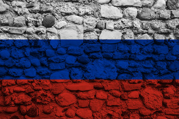 Flag of Russia on old pebble wall