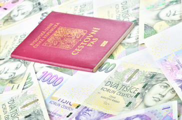 Czech republic passport on banknotes - travel and finance concept