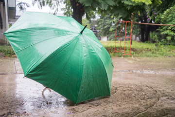The umbrella placed in the rain.