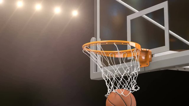 Beautiful Basketball Ball Hits Basket Net Slow Motion Close-up Camera Fly. Ball Flies Spinning into Basketball Hoop Gold Stadium Spotlights. Sport Concept 3d Animation 4k UHD 3840x2160.