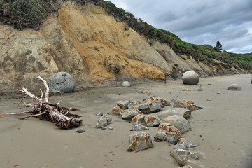 Stone balls on a sandy beach in New Zealand