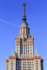 Obraz premium Tower of main building of Moscow State University (MSU) against blue sky in sunny summer evening