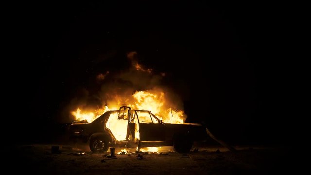Car On Fire, Burning Car At Night, Side View
