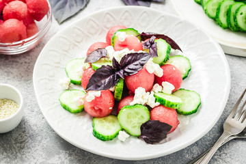 Watermelon cucumber feta salad with balsamic dressing. Selective focus, copy space.