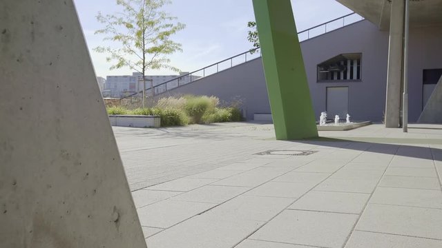 Parcour stunt from a young man in a urban surrounding