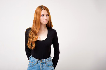 portrait of a beautiful girl with red hair on a white background with different emotions.