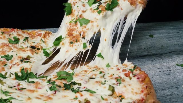 Slice of hot pepperoni pizza, large cheese lunch or dinner with cheese. Frame. Delicious tasty fast food italian traditional on wooden board table