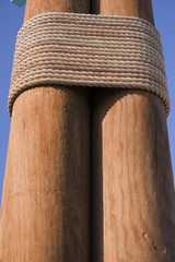 Wooden poles connected by rope