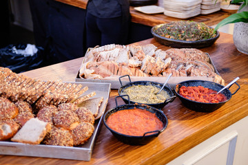 People group catering buffet food outdoor in luxury restaurant. Catering food party at restaurant, mini canapes, snacks and appetizers, wedding food