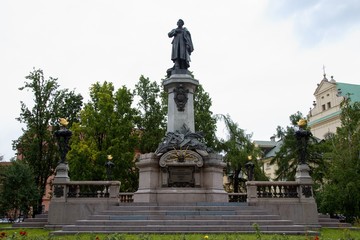 Fototapeta na wymiar Statue of Adam Mickiewicz in Warsaw in Poland, Europe
