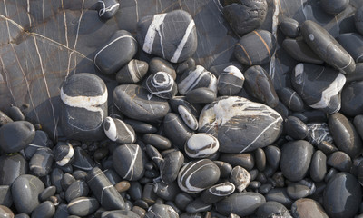 Striped grey and white beach pebbles