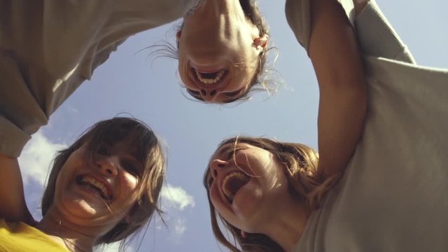 Three teenage girls dancing outdoors