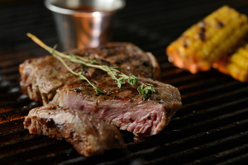 Grilled meat with vegetables and sauce, on the grill
