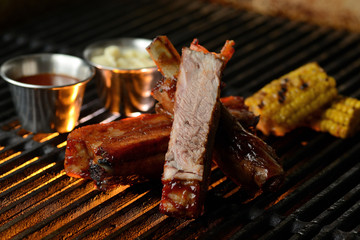 Grilled meat with vegetables and sauce, on the grill