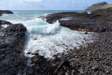 Wild waves crashing on the rocky shoreline near Kalapaki Beach, Kauai, Hawaii