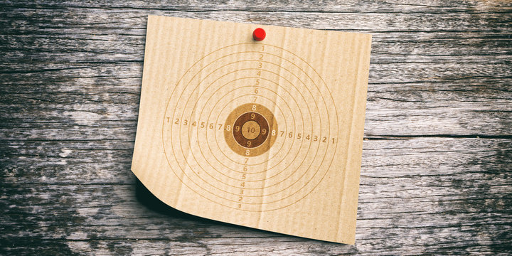 Shooting target on recycling carton paper, wooden wall background. 3d illustration