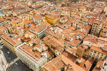 Fototapeta na wymiar Cityscape from height, roofs of red tiles and narrow streets of Florence, Italy