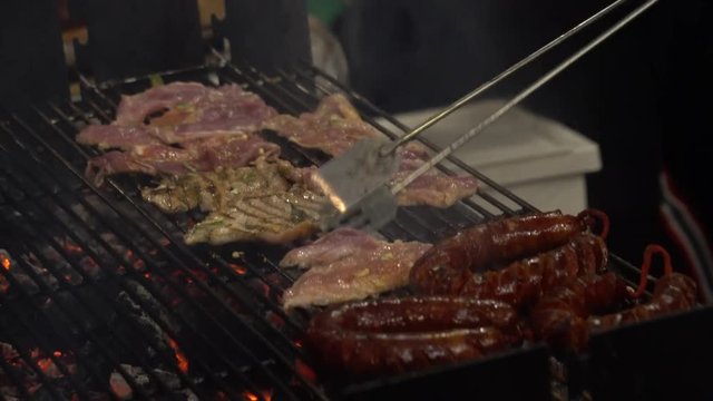 chicken and sausage barbecue made with charcoal in 4k