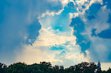 Clouds of the sun sky blue sunlight tree green background