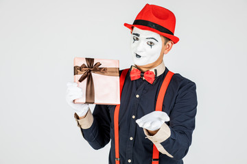 happy MIM holding gift box isolated on white.