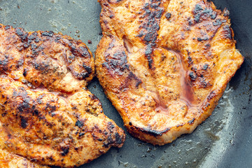 Fried pork in a pan. Preparation of pork in a pan before baking in the oven. Shallow depth of field.