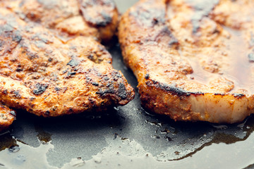 Fried pork in a pan. Preparation of pork in a pan before baking in the oven. Shallow depth of field.
