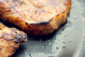 Fried pork in a pan. Preparation of pork in a pan before baking in the oven. Shallow depth of field.