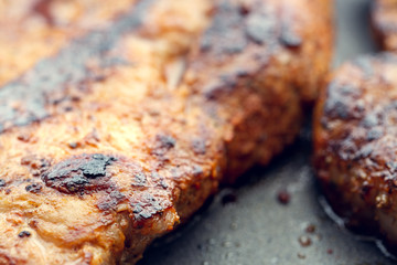 Fried pork in a pan. Preparation of pork in a pan before baking in the oven. Shallow depth of field.