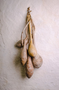 Dried gourds on a rustic wall