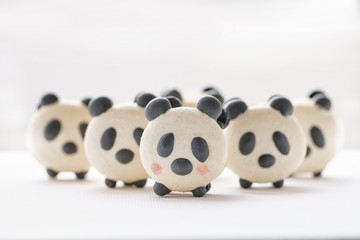 Delicious almond desserts in the form of Panda. French macaron cookies. Cute sweet little animals