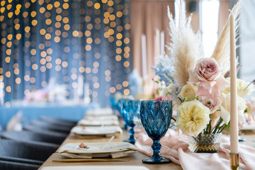 Wedding Banquet or gala dinner. The chairs and table for guests, served with cutlery and crockery....