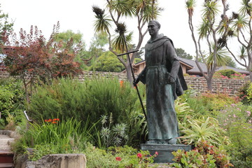 Bronze Statue of Saint Father Junipero Serra in the gardens of the Carmel Mission Basilica in...