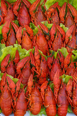 The food delicacies. Fresh boiled crawfish with spices and herbs. On a black chalkboard.