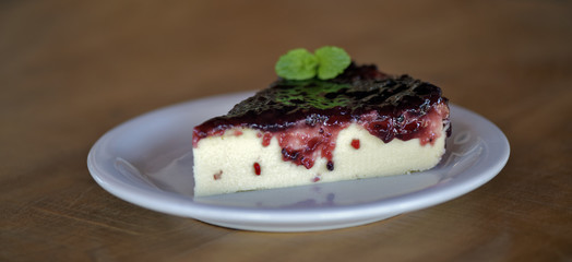 Slice of cheesecake with jam covered