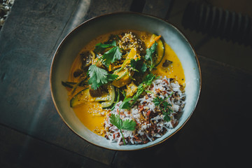 Healthy vegan food on wooden table in coffee shop. 