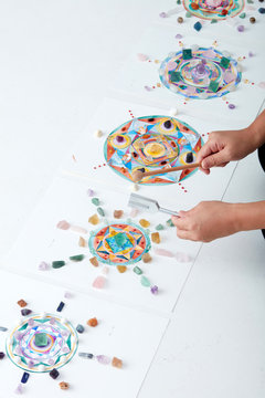 Mandala pattern, watercolor painting. with crystal and hand