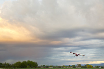 Fototapeta na wymiar Small Plane in the Sunset