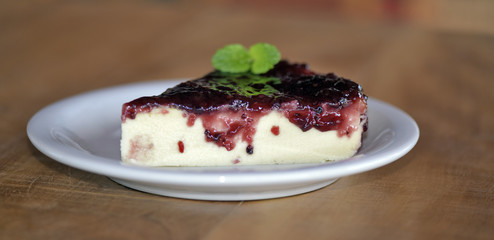Slice of cheesecake with jam covered