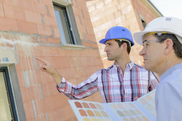 Foreman instructing colleague