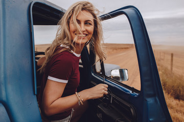 Woman enjoying herself on road trip