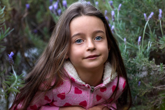 Portrait of young innocent girl in lavendar  flowers