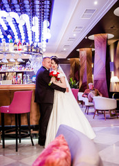 Amazing couple hugging each other in a restaurant